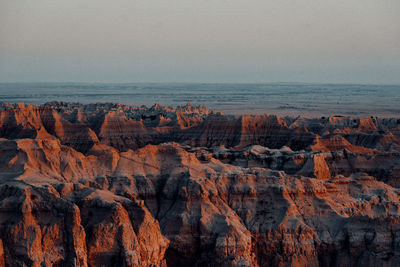 Panoramic view of sea and rock formations against sky