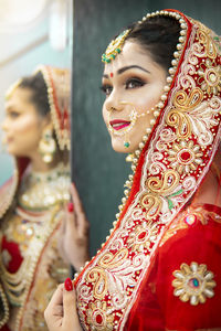 Portrait of young woman in traditional clothing