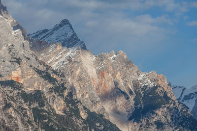 Low angle view of rock formation against sky