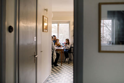 Group of people sitting on table