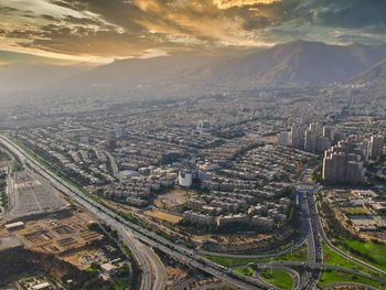 High angle view of city against sky during sunset