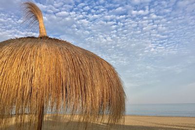 View of calm sea against cloudy sky