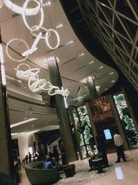 Low angle view of illuminated lanterns hanging in building