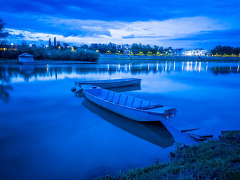 Boat moored in sava river against blue sky