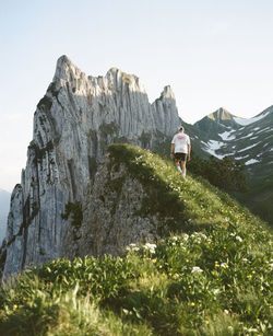 Scenic view while hiking on a ridge in the swiss alps. shot on medium format kodak portra 400 film.