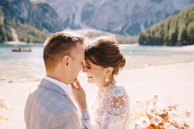 Rear view of couple kissing outdoors