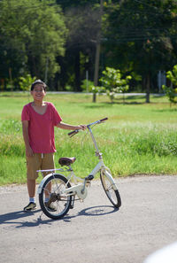 Man with bicycle on street