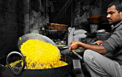 Midsection of man preparing food