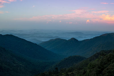 Scenic view of mountains against sky at sunset