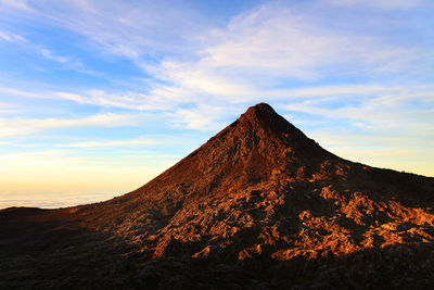 Scenic view of mountain against sky during sunset