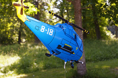 Helium balloon depicting a blue helicopter