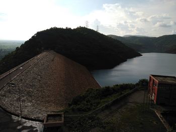 High angle view of mountain by lake against sky