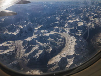 Aerial view of mountains seen through airplane window