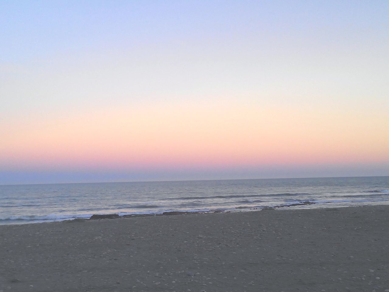 sea, horizon over water, sunset, beach, water, tranquil scene, scenics, copy space, clear sky, tranquility, beauty in nature, shore, orange color, nature, idyllic, sand, sky, remote, outdoors, calm