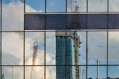 Reflection of buildings on glass window