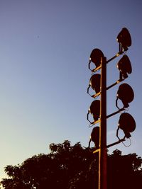 Low angle view of road sign against clear sky