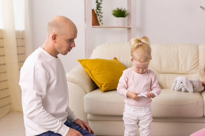 Father and daughter playing at home