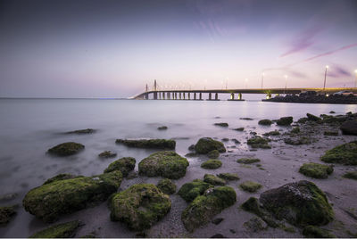 Bridge over sea against sky