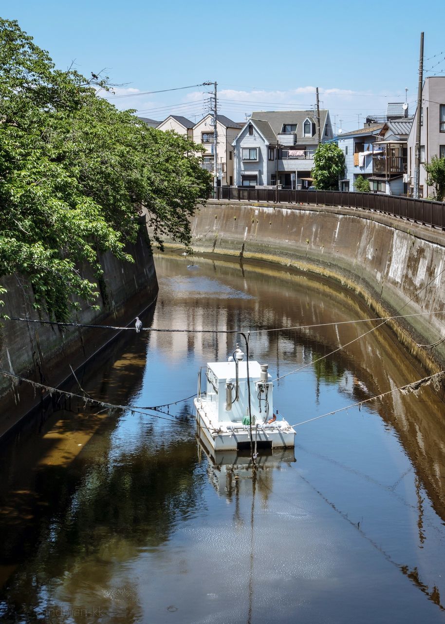 architecture, built structure, water, reflection, building exterior, connection, bridge, bridge - man made structure, nature, sky, day, canal, plant, tree, transportation, waterfront, building, no people, outdoors, arch bridge