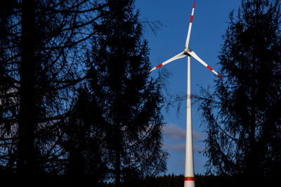 Low angle view of windmill against sky