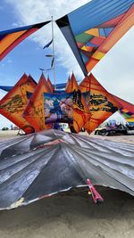 Low angle view of parasol against sky