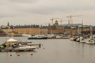 Boats moored at harbor