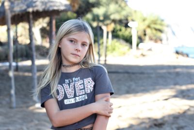 Portrait of girl standing on land