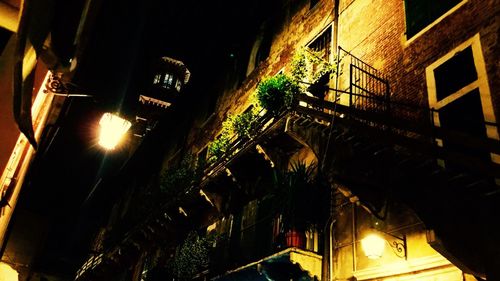 Low angle view of illuminated building at night