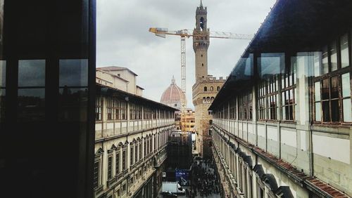 View of bridge in city against sky