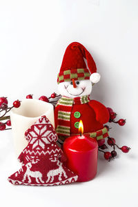 Close-up of christmas decorations over white background