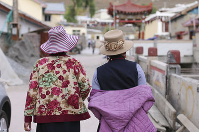 Rear view of people in wearing hat