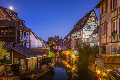 Buildings in city at night