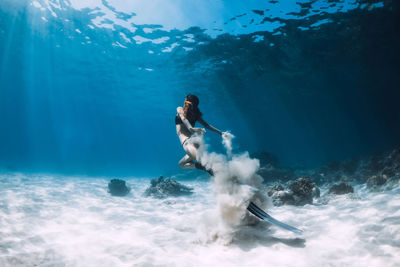 Full length of man surfing in sea