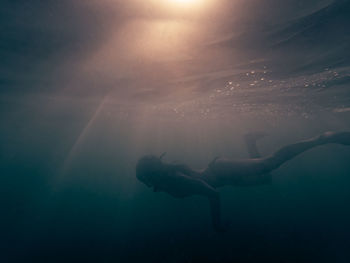 Woman swimming in ocean 