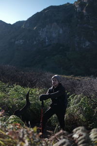 Rear view of man standing on mountain