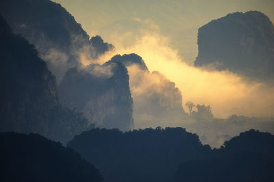 Many mountains with beautiful morning light and fog.