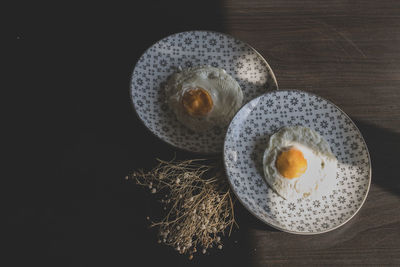 High angle view of breakfast with plant on table