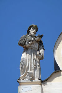 Saint john of nepomuk on the top of parish church of saint nicholas in cakovec, croatia