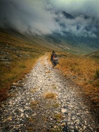 Scenic view of mountain road against sky