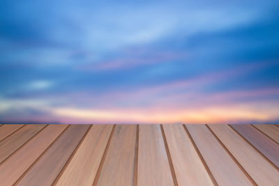 Close-up of wood against sky during sunset