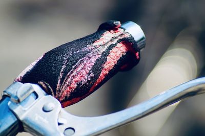 Close-up of bicycle on metal railing