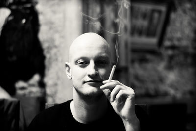 Portrait of man smoking cigarette