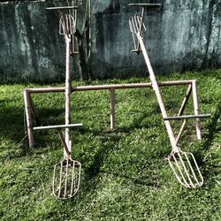 Chairs on field against trees in yard