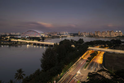 High angle view of illuminated city against sky