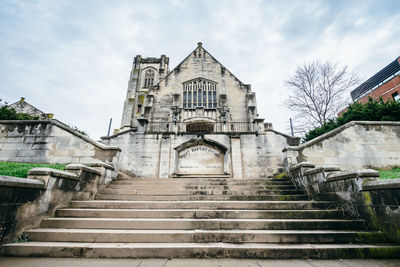 Low angle view of staircase of building against sky