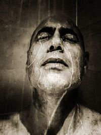 Close-up portrait of man with eyes closed