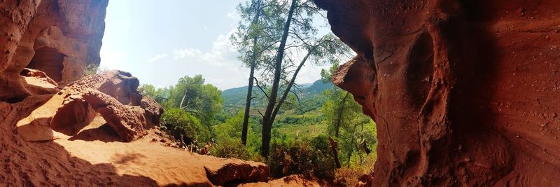 Panoramic view of rock formations against sky