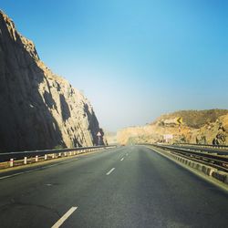 Jaipur highway by mountain against clear sky