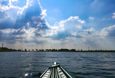 Sailboat sailing in sea against sky