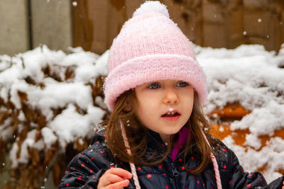 Portrait of cute girl in snow during winter